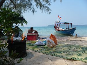 Sitting on a deserted beach, Cambodia - Baracuda BBQ on its way