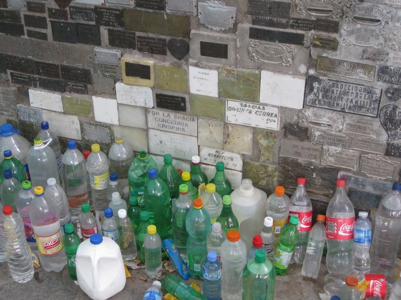 Votive plaques and water bottles, Difunta Correa shrine