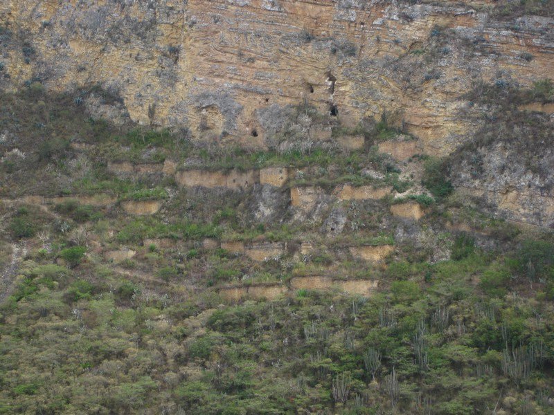 Ancient Chachapoyas dwellings hugging the mountainside