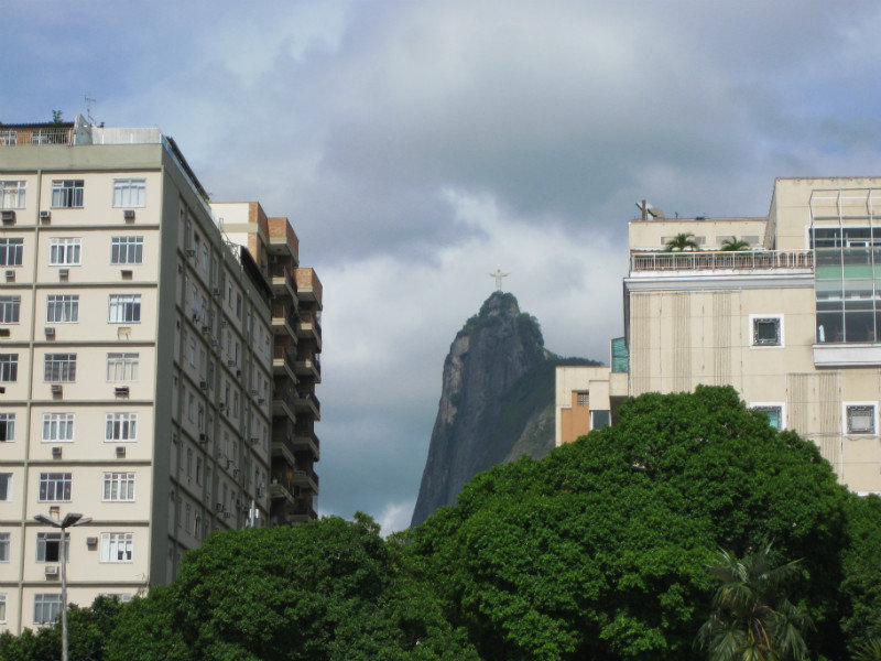 Corcovado and Cristo Redentor peeking between the buildings of Copacabana