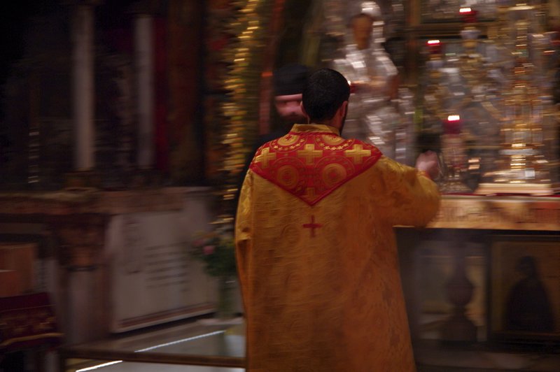A priest in the Church of the Holy Sepulchre