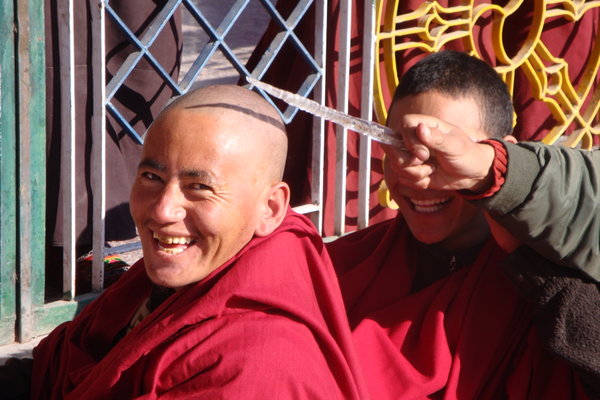 Monks playing with ice