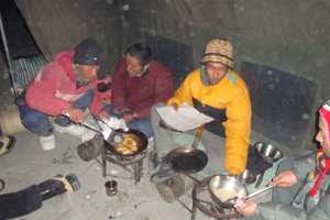 Lopsang, Tenzing and Tsering preparing a meal