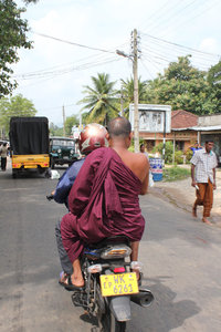 Buddhist monk on motorbike