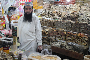 Muslim selling dried fish at market Nuwara