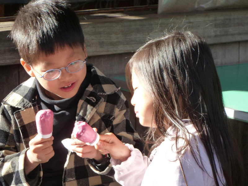Brother and sister enjoying ice cream at Chiyoda, Tokyo
