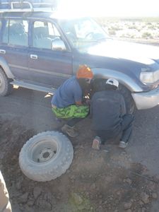 Troy changing the flat tyre