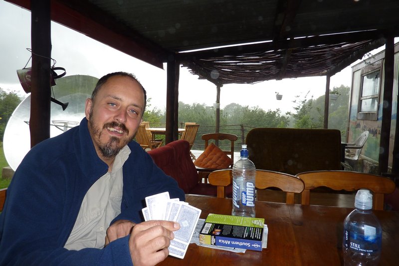 Sitting out the rain.... he was so happy despite knowing that I was winning...hehe