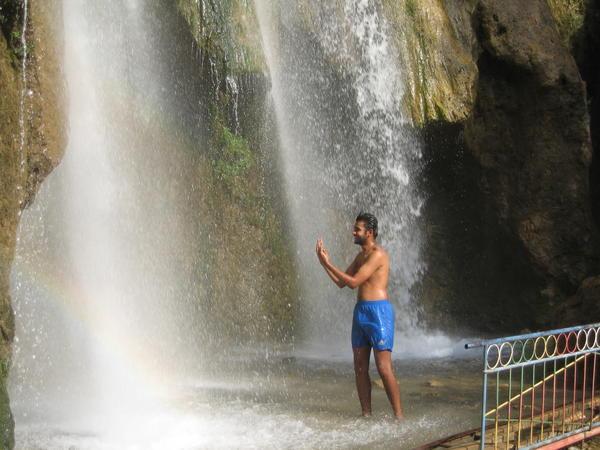 Indie, under a waterfall in Arslanbob