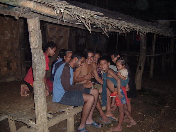 Laos - local villagers, enthralled by Indie's photos