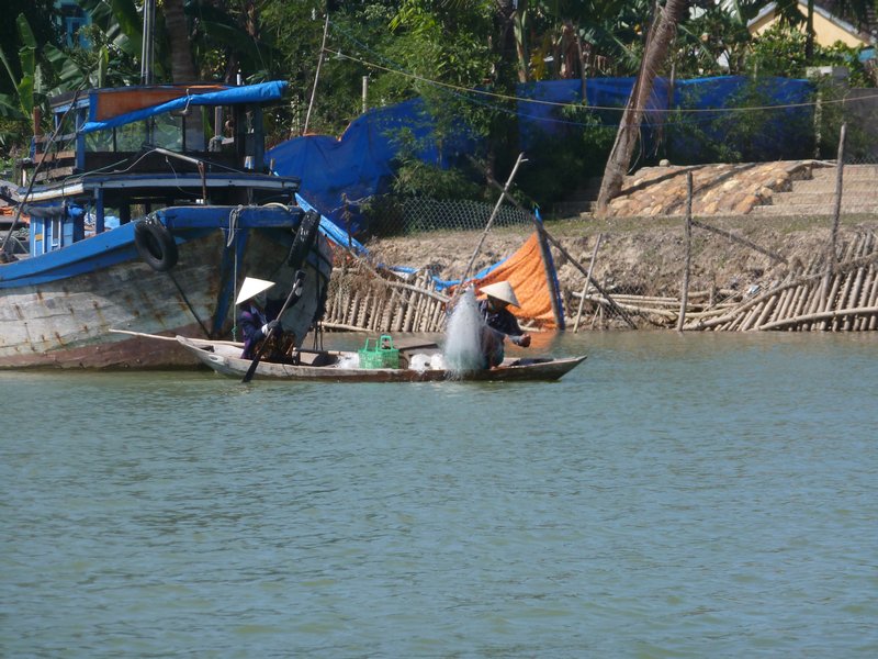 Hoi An - Some locals fishing, looks hard work!