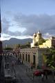 Sun setting: View of street and church in Oaxaca city