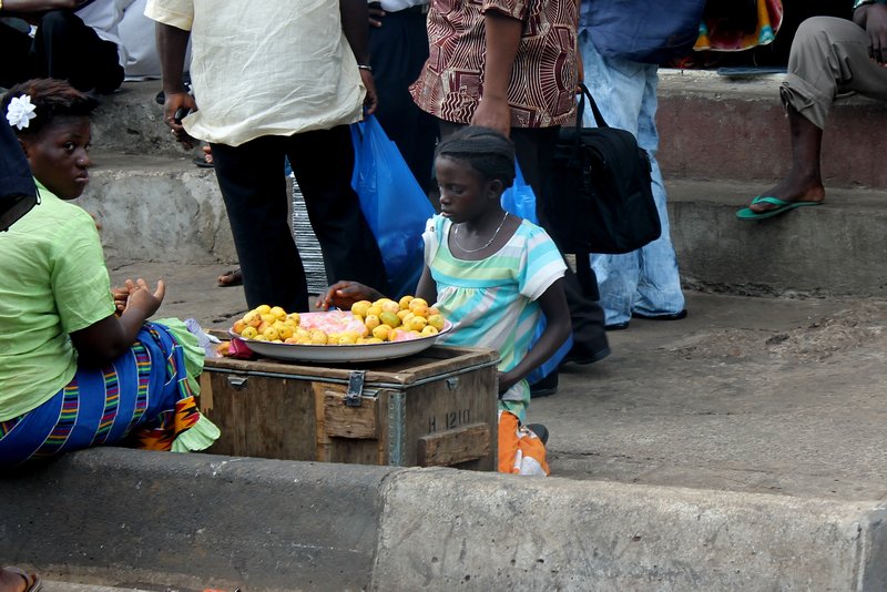 child selling fruit