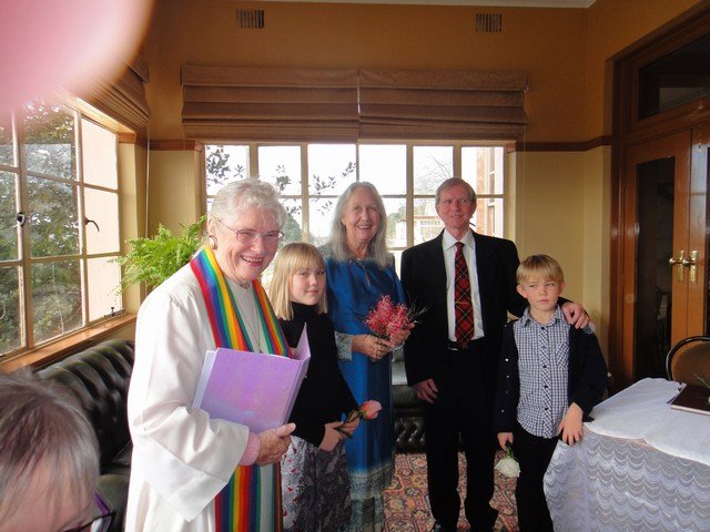 Married couple with grandkids and celebrant