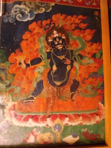 A wall painting of the protector Buddha (I think) in the nunnery.