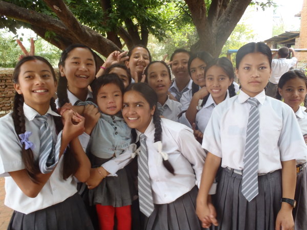 A group of class 8 girls in the playground.