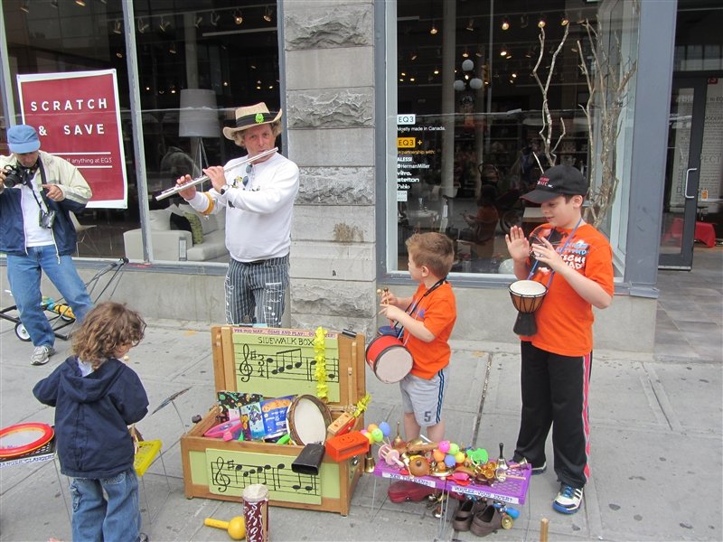 The boys playing in the street performer band.