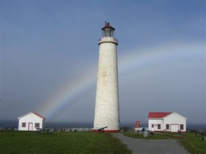 Cap des Rosiers lighthouse with rainbow
