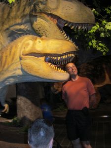 Claude being eaten by a dinosaur