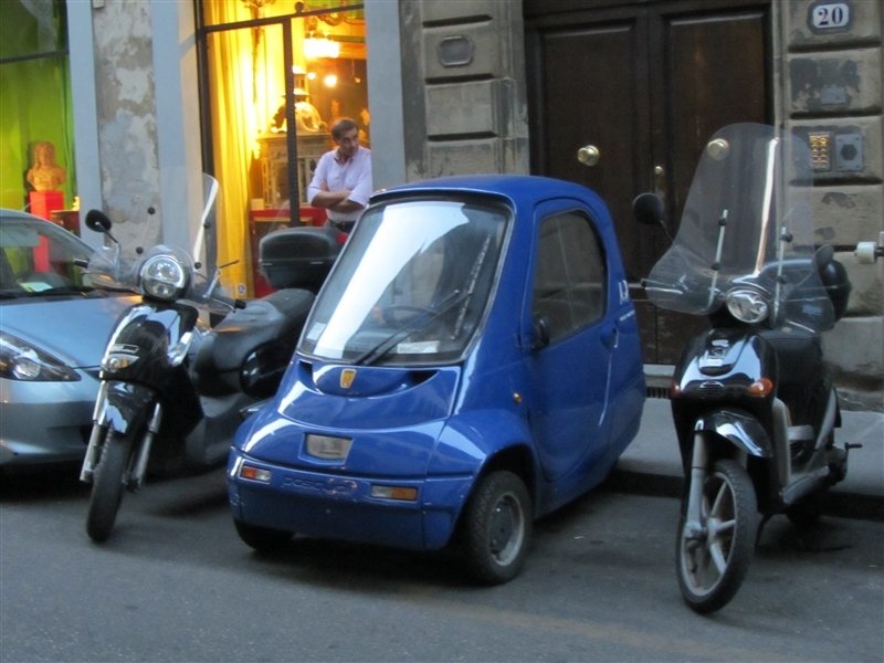I loved these mini cars.  they were called electric rickshaws.