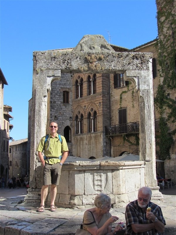 Claude at the town well in one of the piazzas