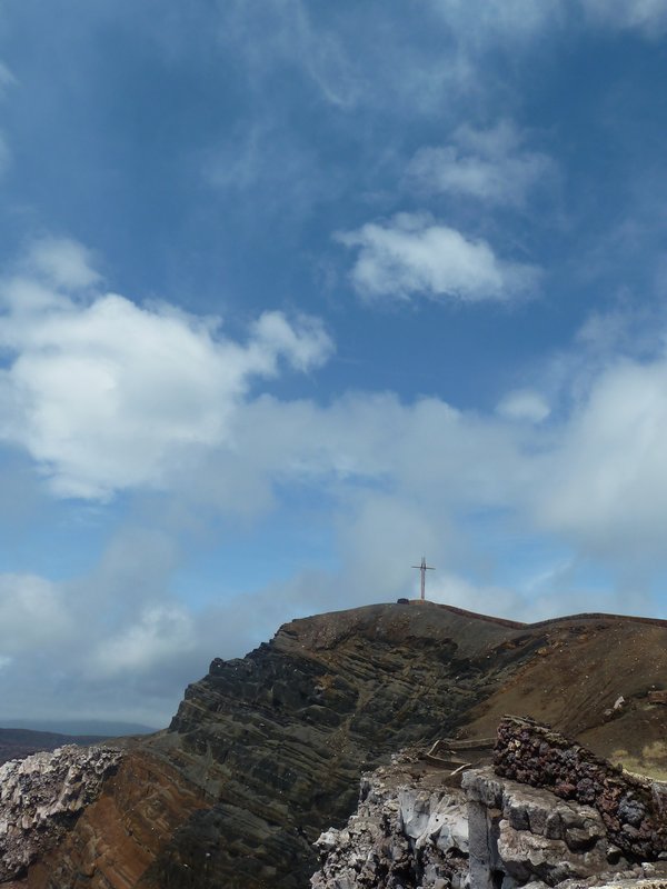 This cross marks the sight where the Volcano was exorcised  as it is believed to be the gates of hell, there has been a cross marking this sight ever since