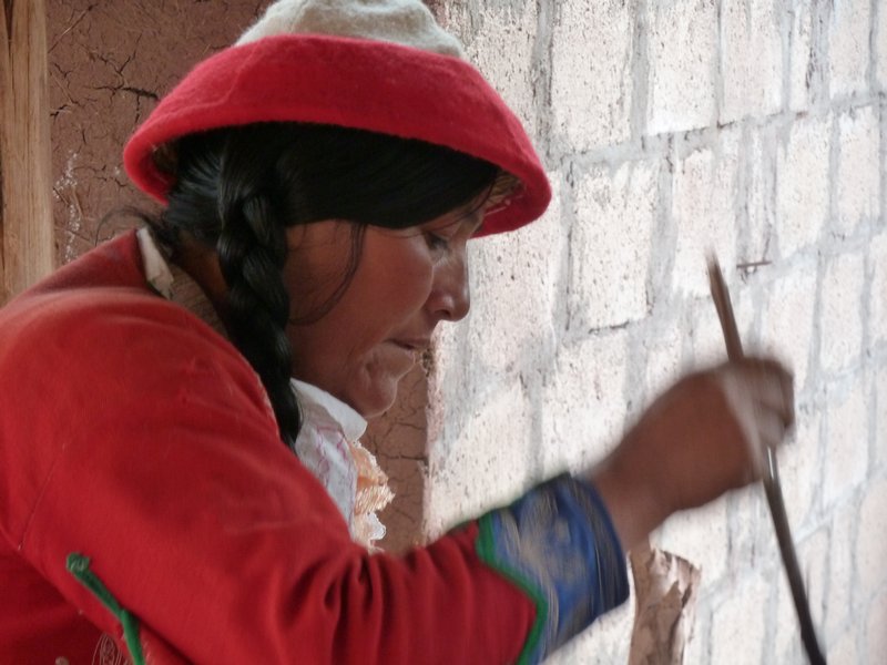 Local woman preparing the alpaca wool