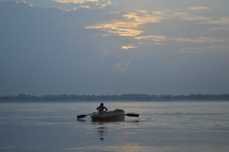Lone boatman in the Ganges