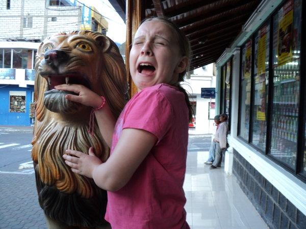 Abbey being attacked by a lion outside a restaurant