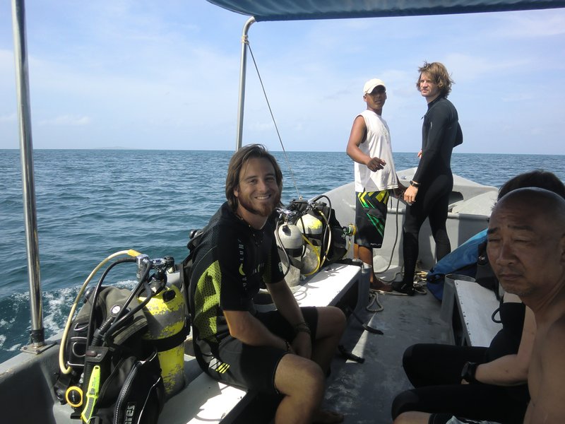 On the boat and ready to dive. Those wetsuits sure are cute.