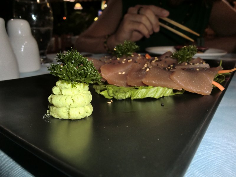 Delicious sushi and a wasabi bonzai treee.