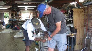 Chris trying to get the zip fixed on his shorts, Antigua