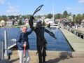 Me with a statue at Baddeck (It was very windy!!)