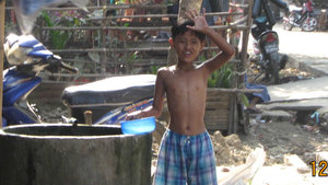 Boy washing in Dhala