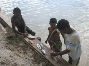 Local kids cleaning their fish