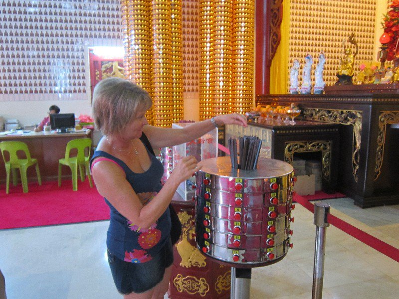 In the temple picking out a guidance stick from Buddah
