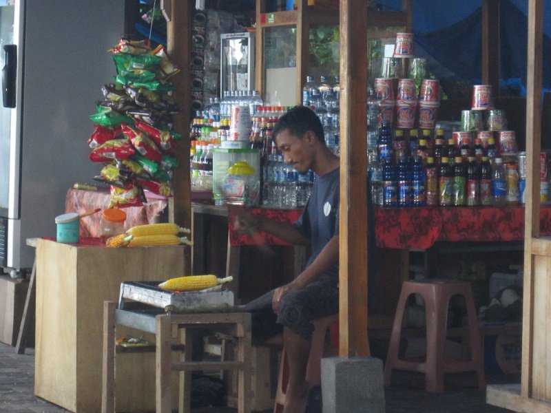 Vendor fanning his corn