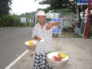A friendly fruit vendor