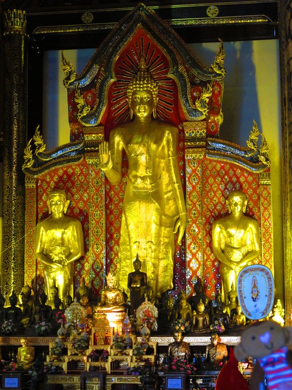 Shrine with monks chanting