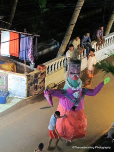 devils for Dewali parading down the street