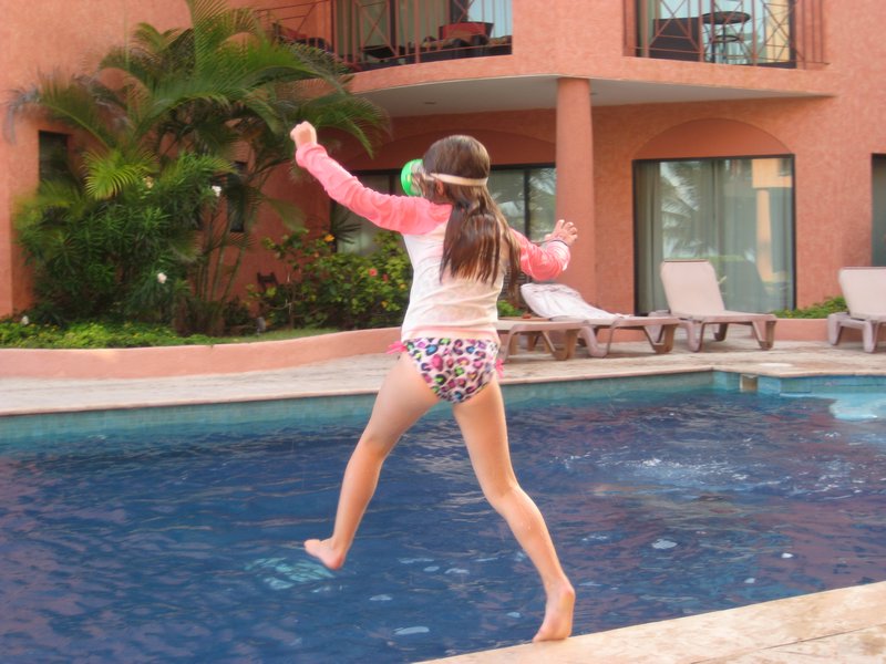 Ava jumping in pool