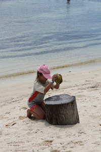 Ava breaking coconuts!