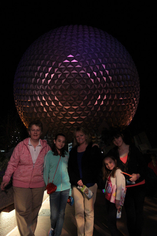 US in front of sphere