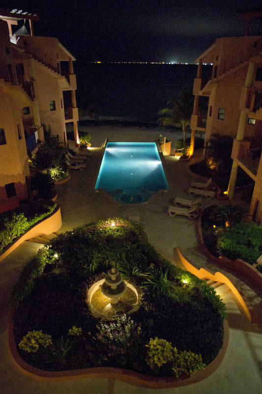 Beautiful view of pool/ocean at night