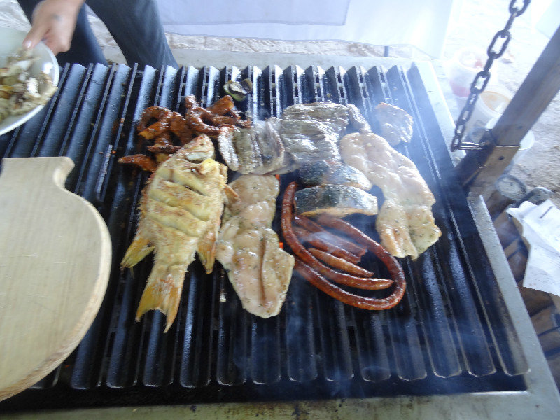 Fish, salmon, sausage, beef on BBQ