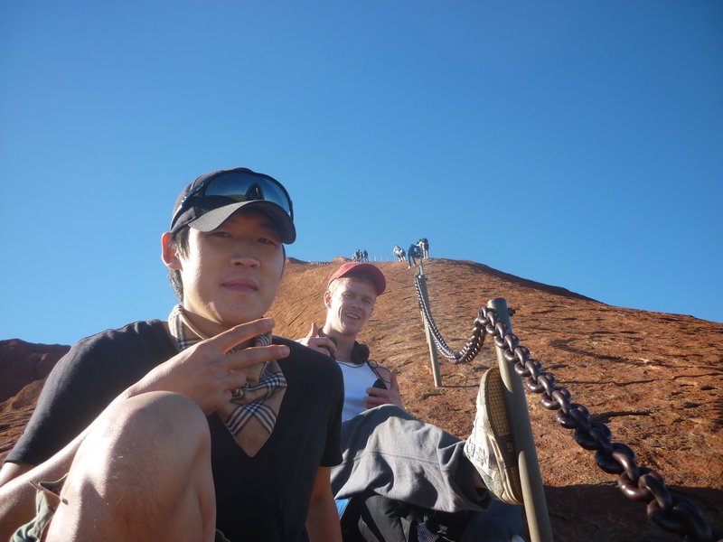 Juhyun (South Korea) and Scott (UK) climbing Uluru