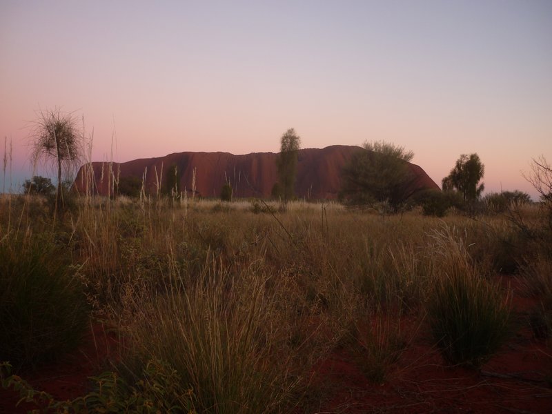 light blue sky sunrise Uluru