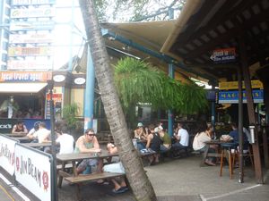 people drinking in outside bar Magnums Airlie Beach