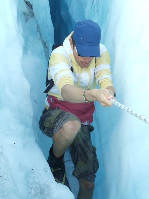 me climbing a cave at Franz Josef Glacier