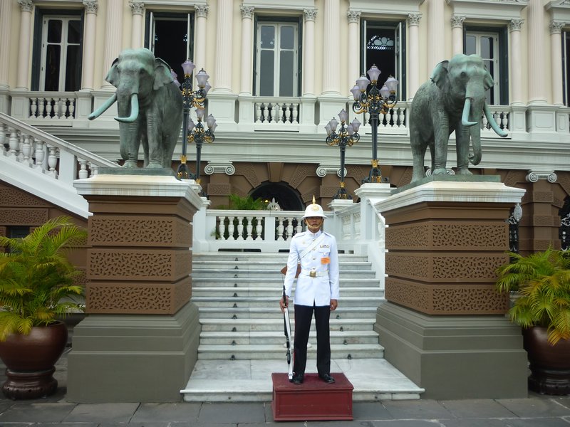 guard in between two elephants Grand Palace Bangkok